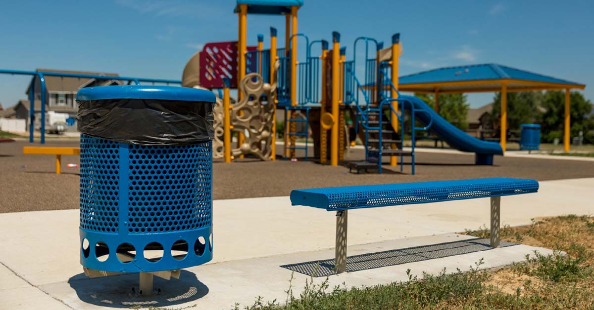 Commercial trash can at a public playground