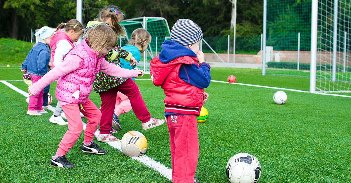 An example of young children playing a kids sport