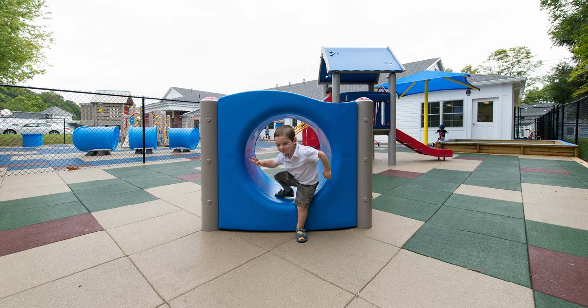 An example of a boy playground on rubber tile playground surfacing