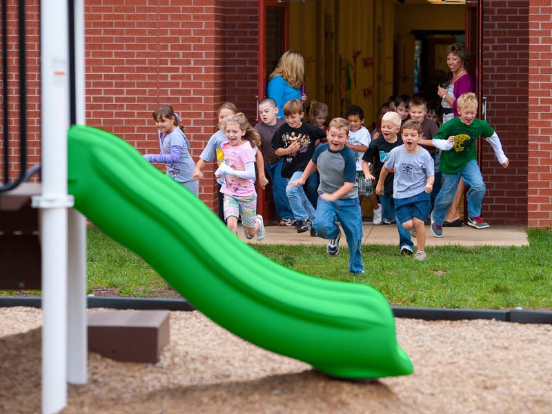 Kids running to the school playground to fight childhood obesity