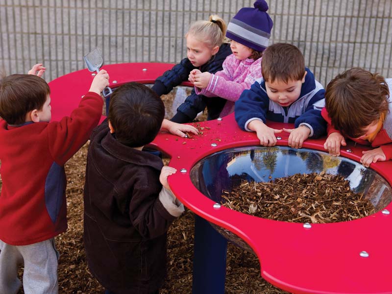 Children playing with a sensory table