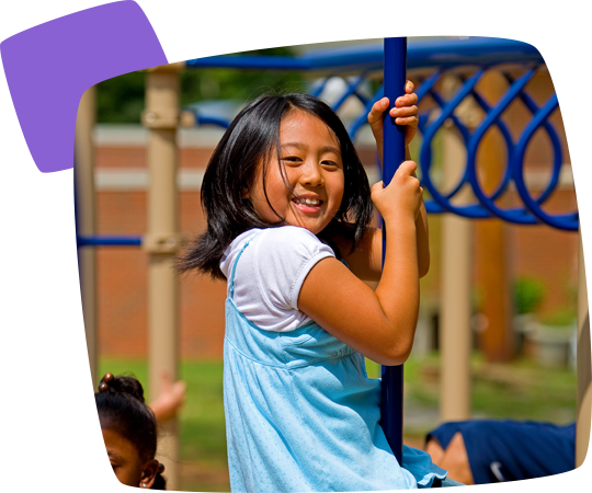 girl climbing down a climber pole